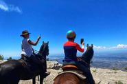 Riders taking pictures of the view 