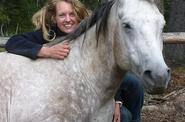 Woman hugging a horse 