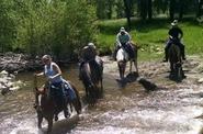 Riders crossing the river 