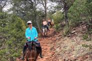 Riding atop a horse 