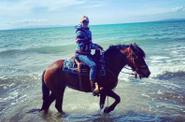 Riding along the beach