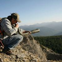 A tourist observing mountain panorama 