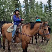 Girl atop a horse 