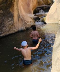 Taking a dip in the mountain river 