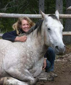 Woman hugging a horse 