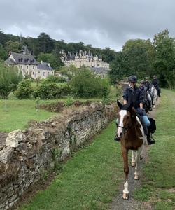 Horse riding in a village