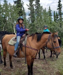 Girl atop a horse 